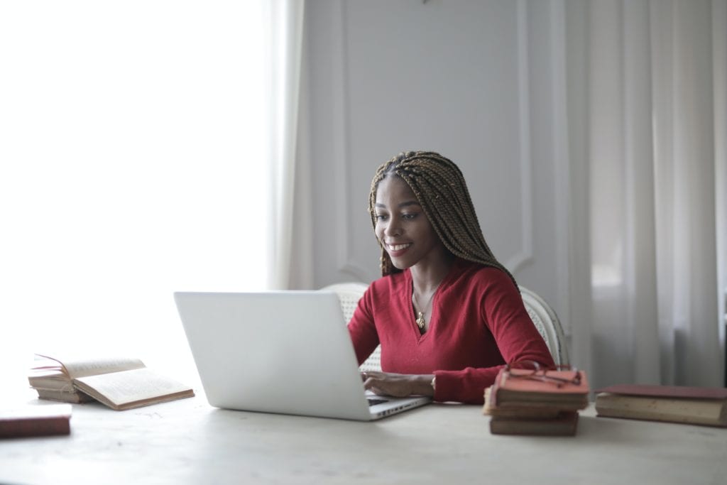 happy woman using laptop